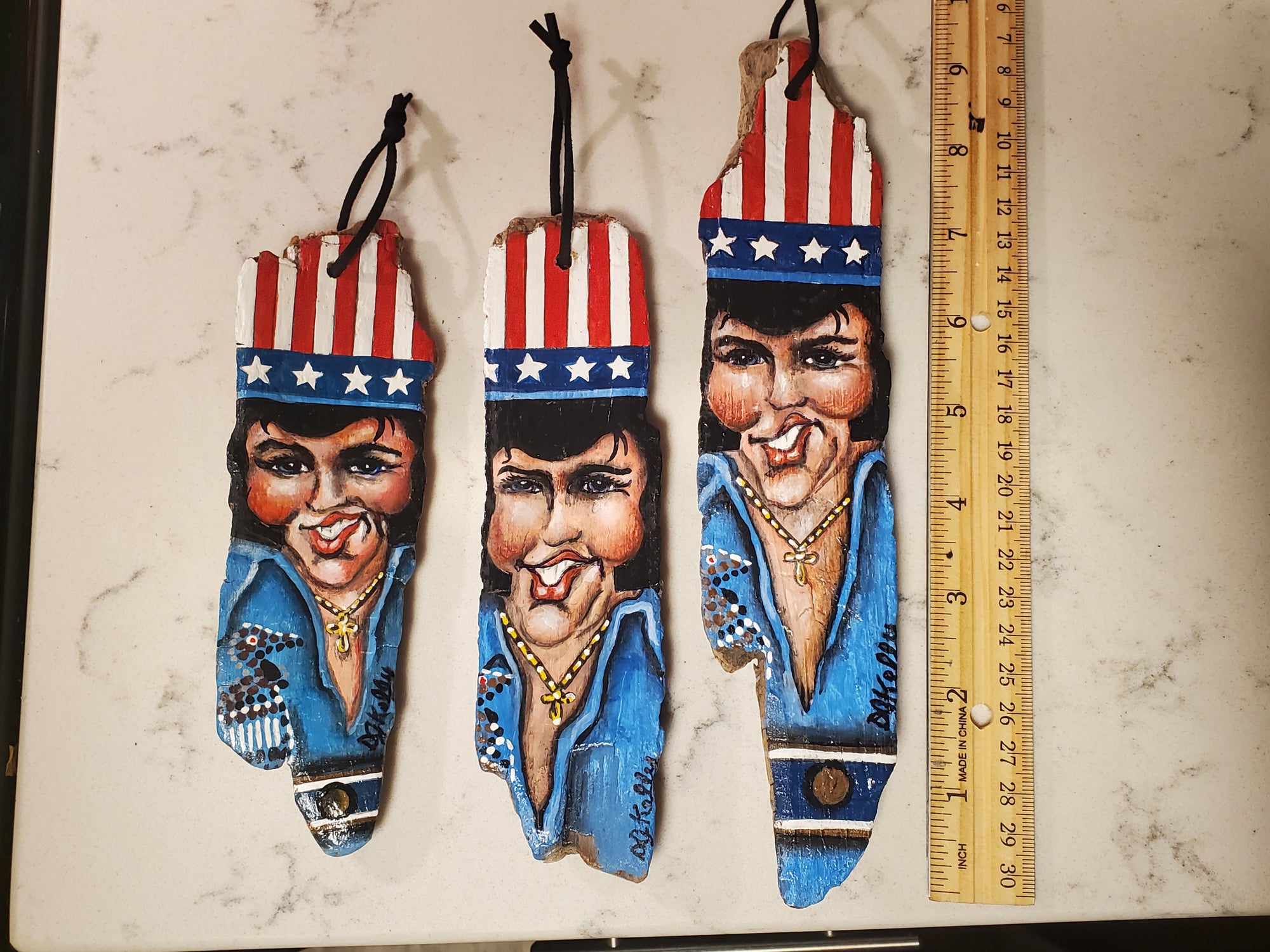 Elvis ornaments painted on MS river driftwood by local Artist DJ Kelly