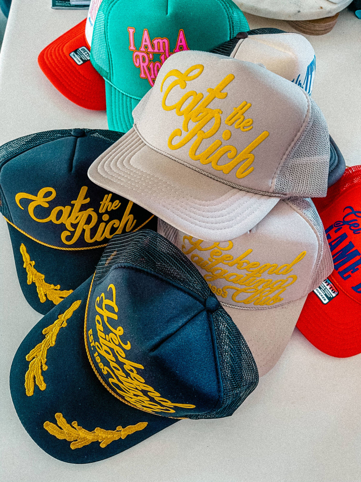 Weekend Tailgating Club, Game Day Trucker Hat: Black/Gold Leaf