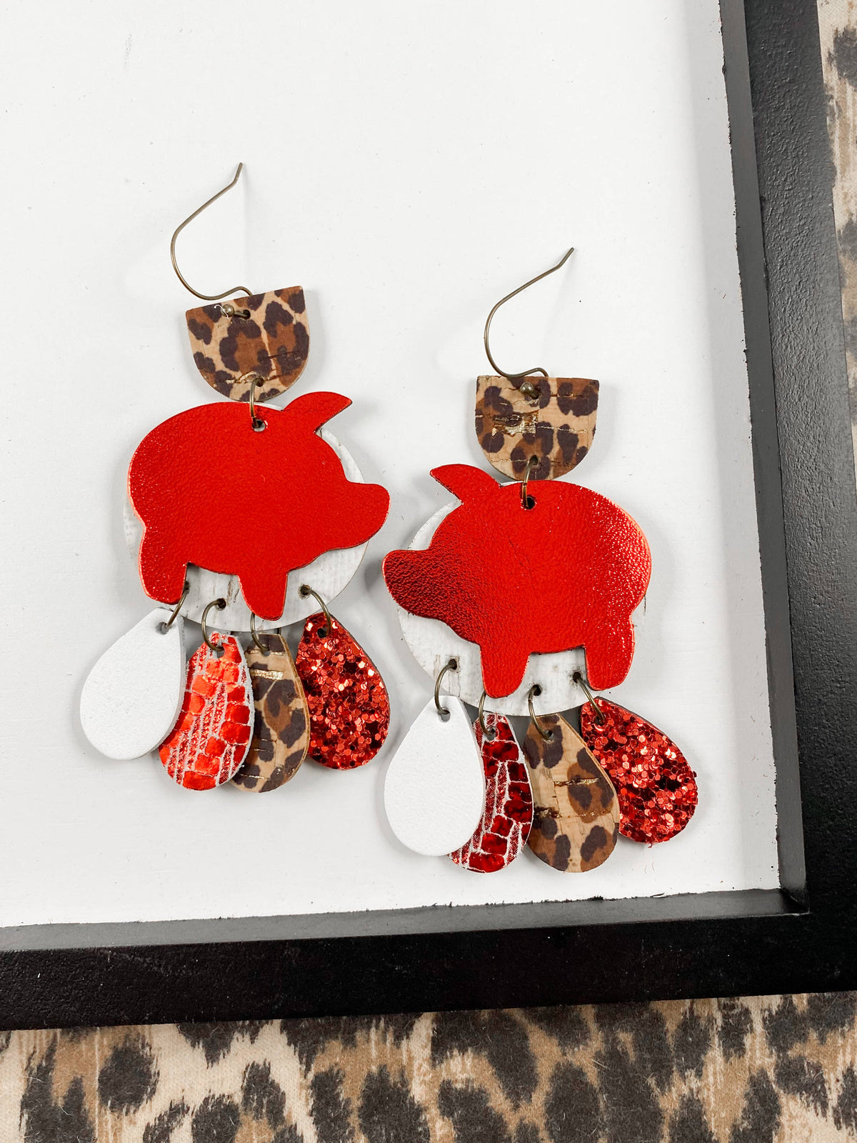 Red Pig Chandeliers | AR white leopard hog leather earrings